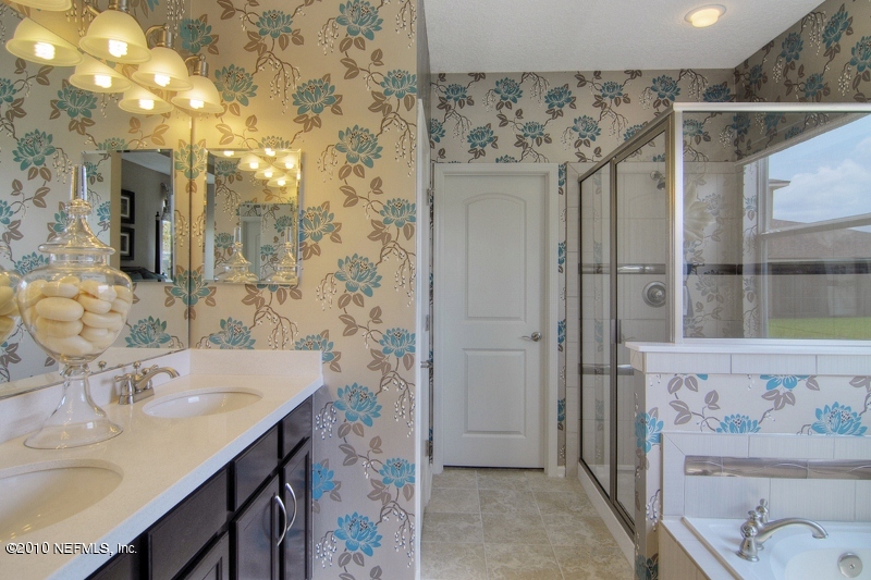 906 East Red House Branch Road St. Augustine, FL 32084 - Photo 11 of 13 a bathroom with a sink and a mirror