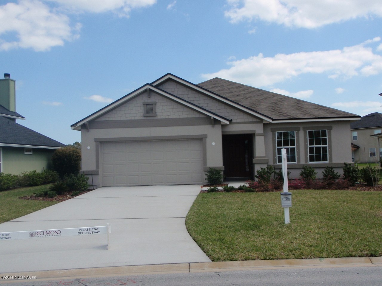 906 East Red House Branch Road St. Augustine, FL 32084 - Photo 2 of 13 a front view of a house with a yard