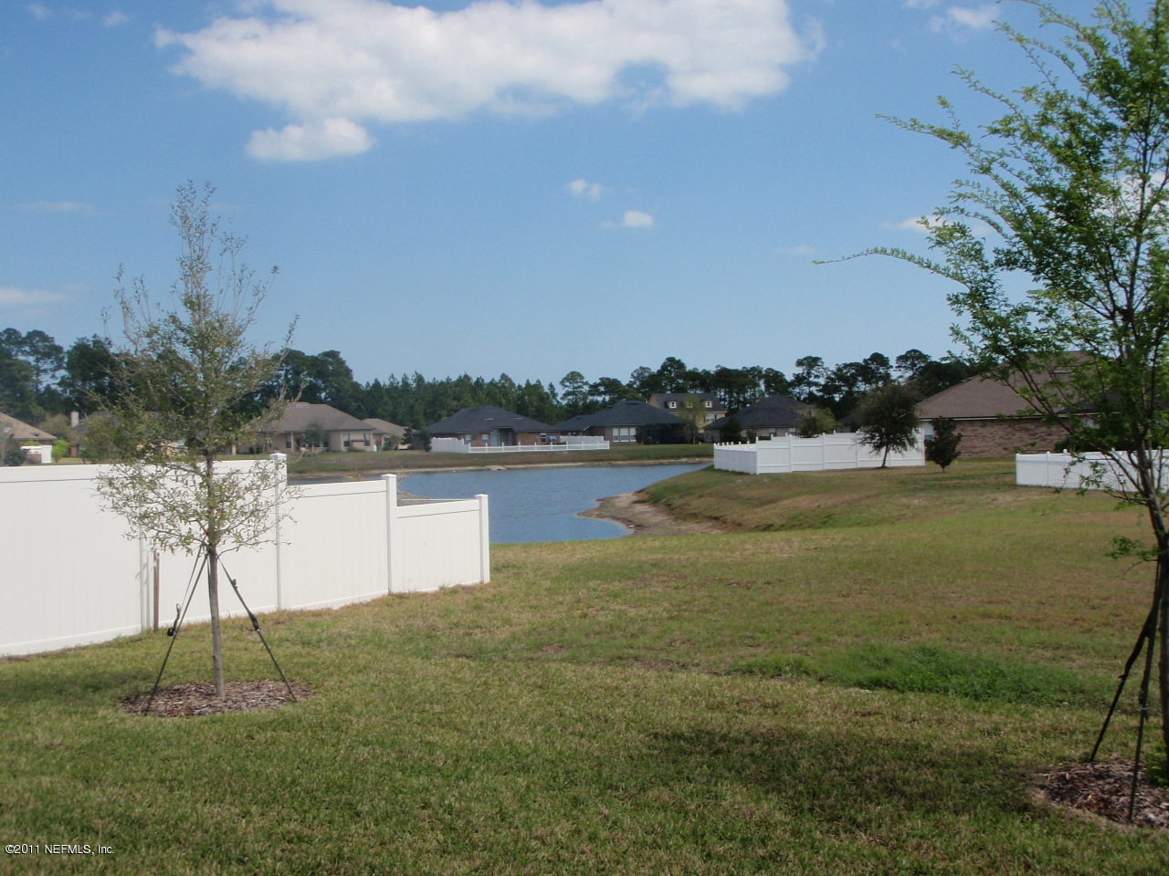906 East Red House Branch Road St. Augustine, FL 32084 - Photo 4 of 13 a view of a lake with a yard