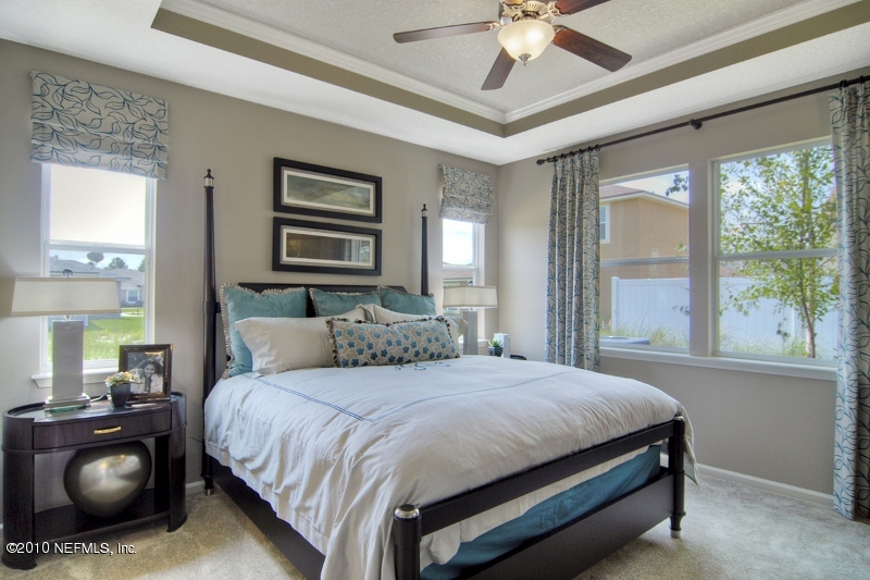 906 East Red House Branch Road St. Augustine, FL 32084 - Photo 10 of 13 a bedroom with a bed and window