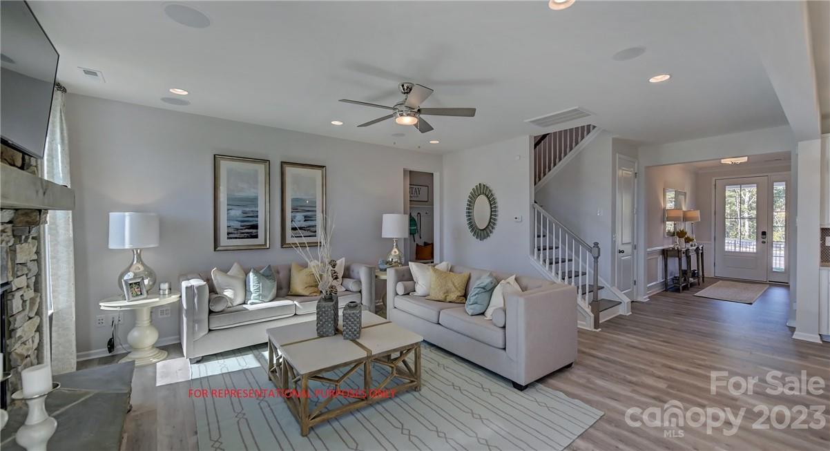 4184 Charlton Road, Unit 203 Fort Mill, SC 29715 - Photo 9 of 22 a living room with furniture and a wooden floor
