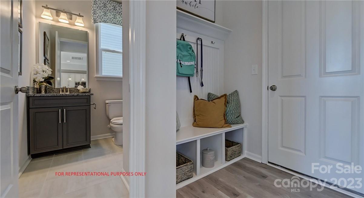 4184 Charlton Road, Unit 203 Fort Mill, SC 29715 - Photo 10 of 22 a bathroom with a toilet sink and mirror