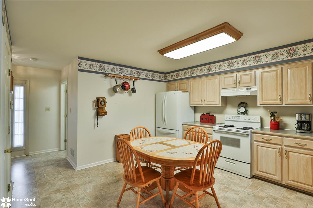 507 Howertown Road Northampton, PA 18067 - Photo 7 of 46 A quaint eat-in kitchen with classic wooden cabinetry and light-colored flooring offers everyday functionality.