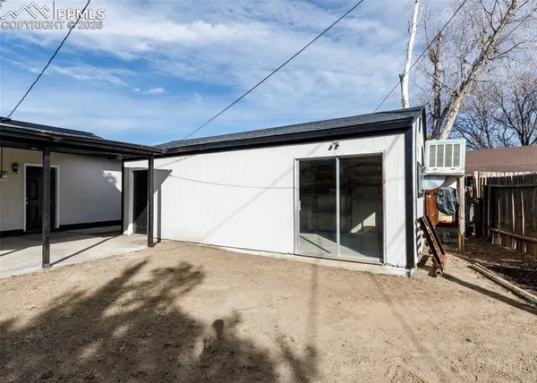 a view of house with yard
