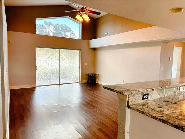 a view of a kitchen with a sink and a window