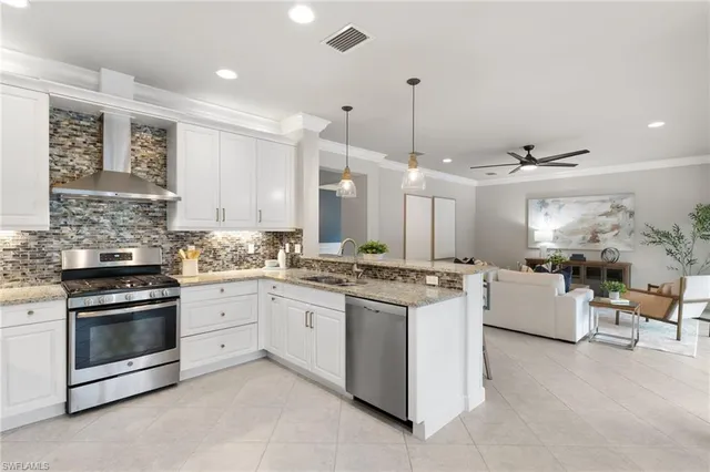 a kitchen with a stove and a sink