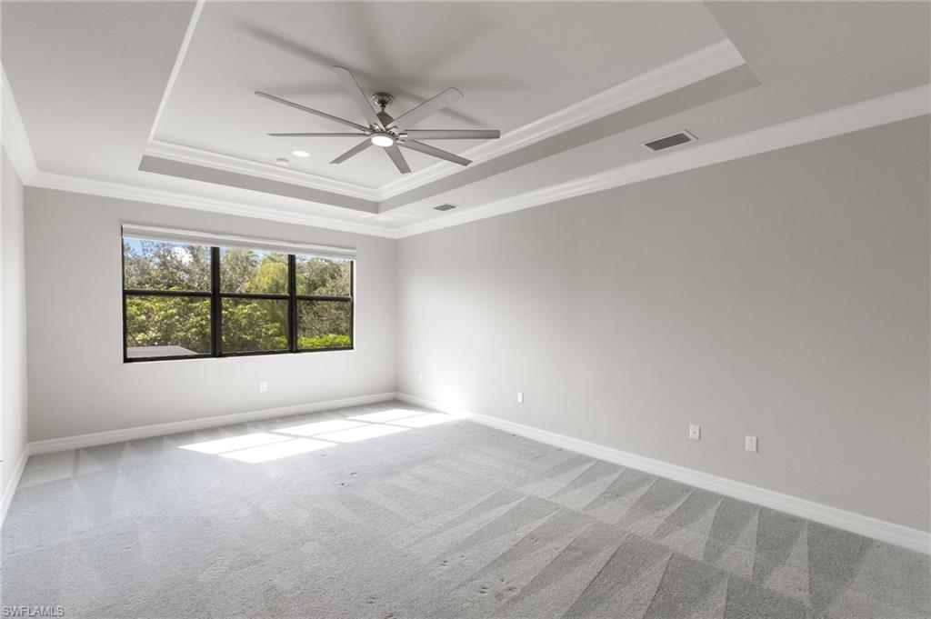 4384 Aurora Street Naples, FL 34119 - Photo 20 of 47 a view of an empty room with a window