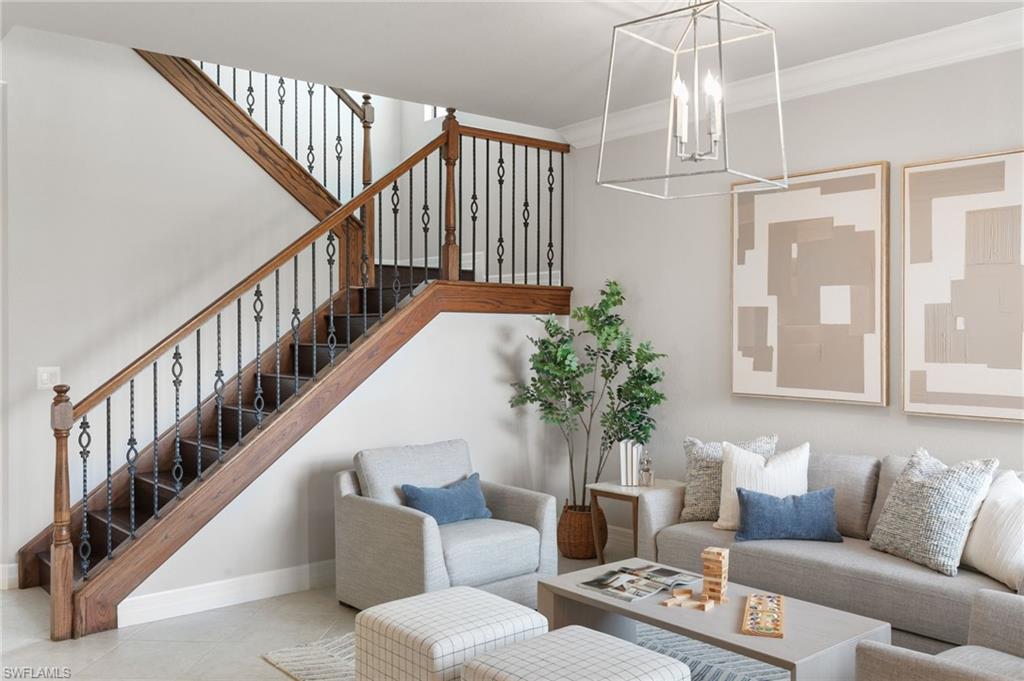 4384 Aurora Street Naples, FL 34119 - Photo 4 of 47 a living room with furniture or stairs and a couch