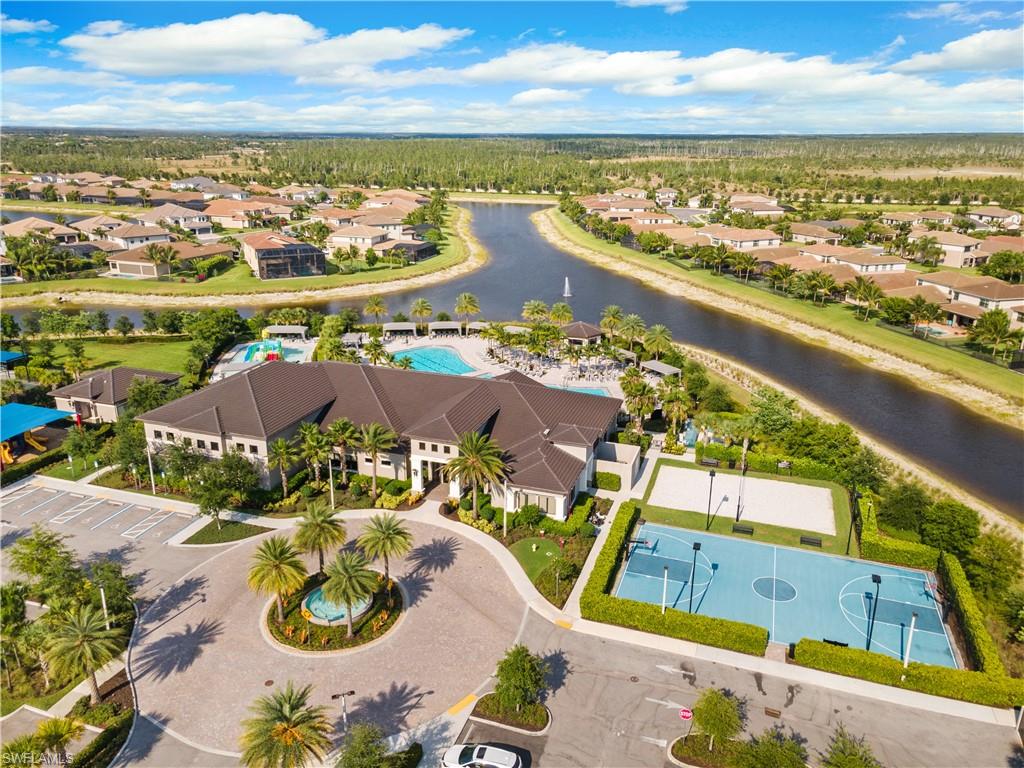 4384 Aurora Street Naples, FL 34119 - Photo 43 of 47 an aerial view of residential houses with outdoor space and ocean view