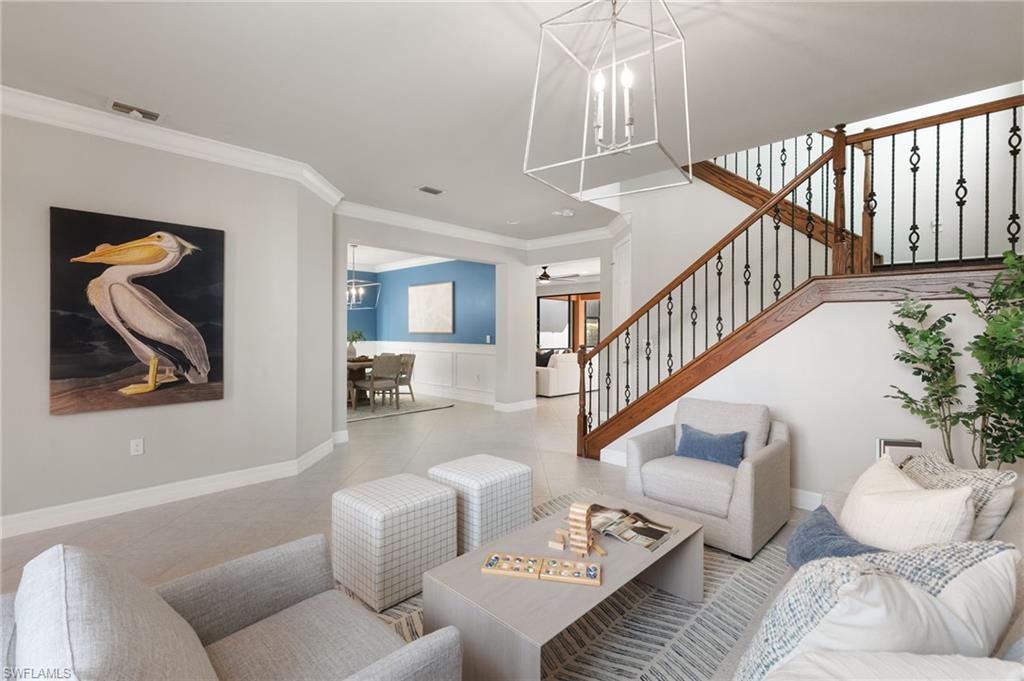 4384 Aurora Street Naples, FL 34119 - Photo 5 of 47 a living room with furniture and wooden floor