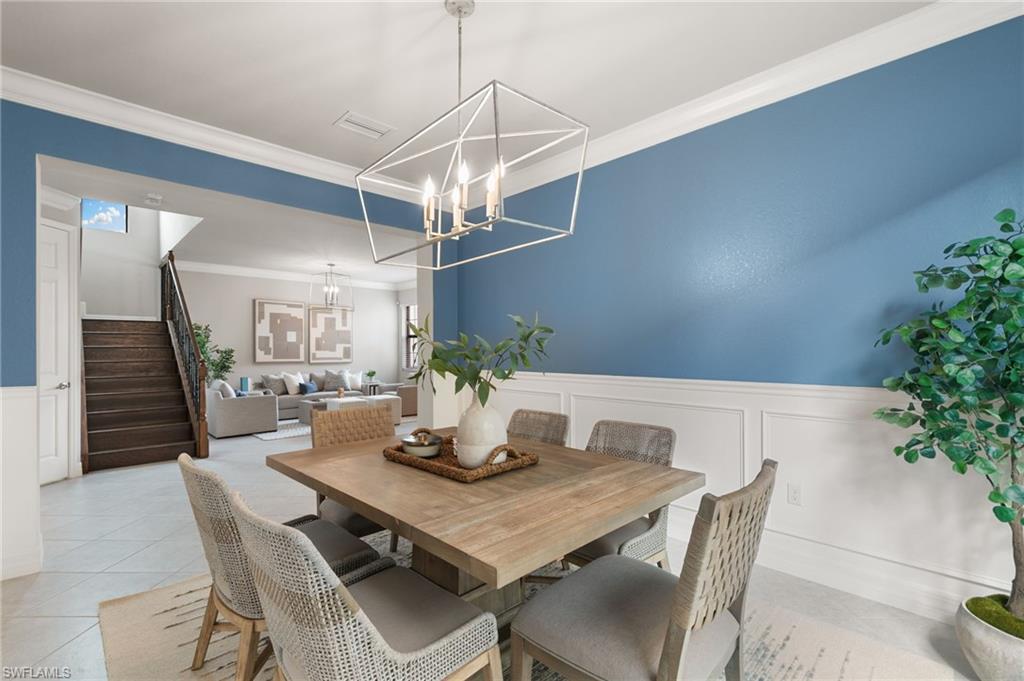 4384 Aurora Street Naples, FL 34119 - Photo 9 of 47 a view of a dining room with furniture