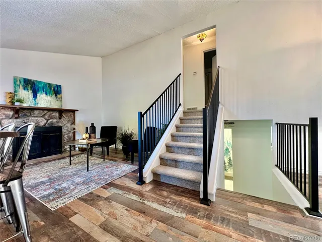a view of a livingroom with furniture and a floor to ceiling window
