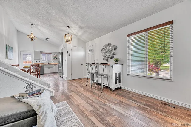 a view of a livingroom with furniture and a window