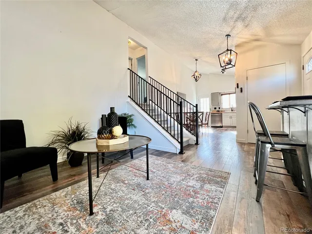 a view of a livingroom with furniture and wooden floor