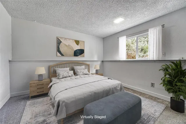 a bedroom with a bed and window