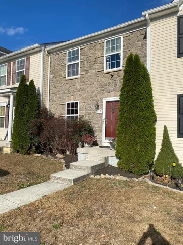 a large kitchen with stainless steel appliances granite countertop a stove and a refrigerator