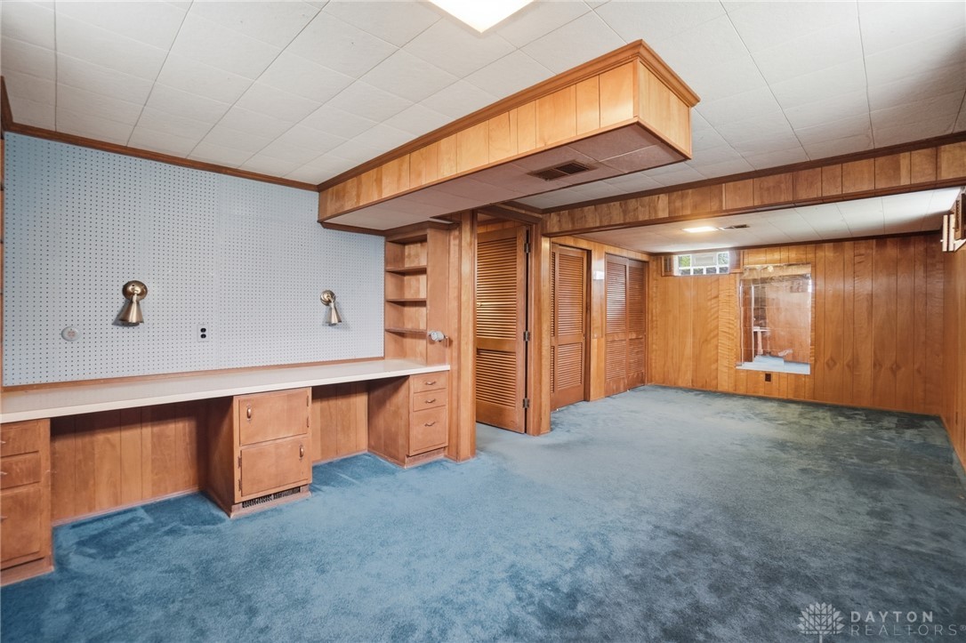 6119 Flemington Road Dayton, OH 45459 - Photo 47 of 76 This versatile basement offers a practical workspace and ample storage.