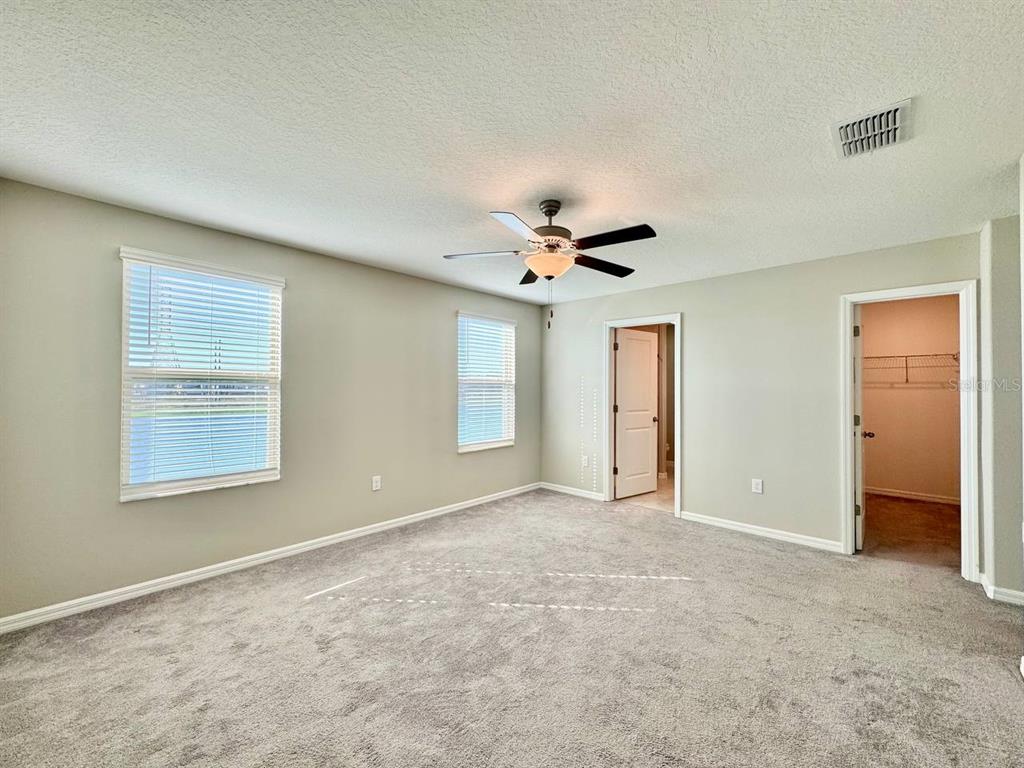 7020 Samuel Ivy Drive Tampa, FL 33619 - Photo 12 of 41 an empty room with windows and closet