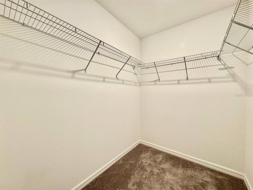 7020 Samuel Ivy Drive Tampa, FL 33619 - Photo 14 of 41 a view of a room with racks on the wall