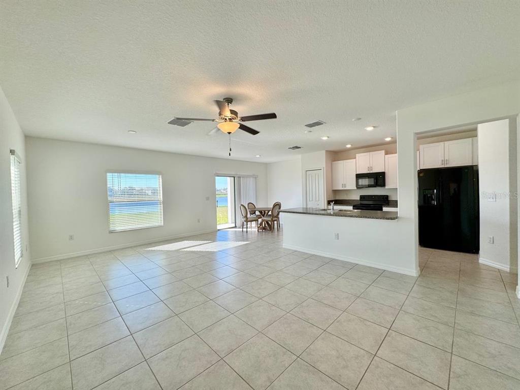 7020 Samuel Ivy Drive Tampa, FL 33619 - Photo 2 of 41 a view of kitchen with windows and refrigerator