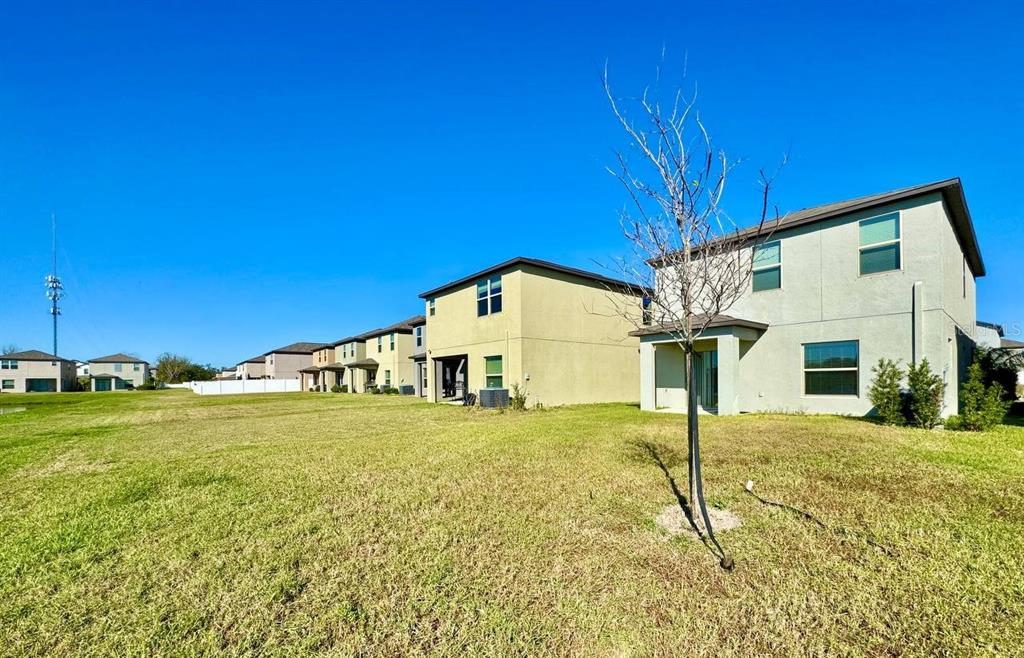 7020 Samuel Ivy Drive Tampa, FL 33619 - Photo 29 of 41 a view of a house with a yard