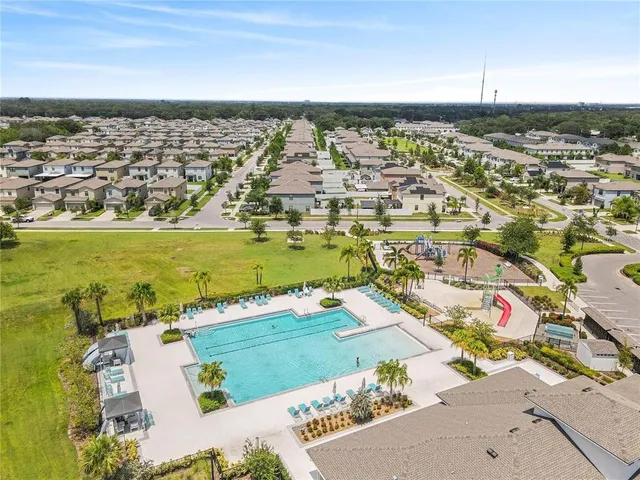 an aerial view of residential building and ocean view