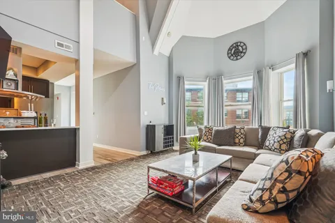a living room with furniture and a couch