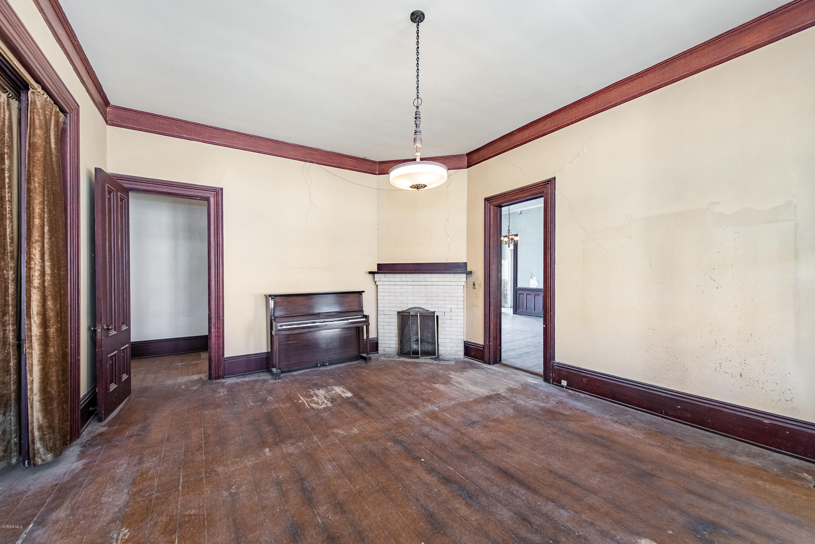 1226 Ojai Road Santa Paula, CA 93060 - Photo 12 of 73 a view of a livingroom with a ceiling fan window and hardwood floor