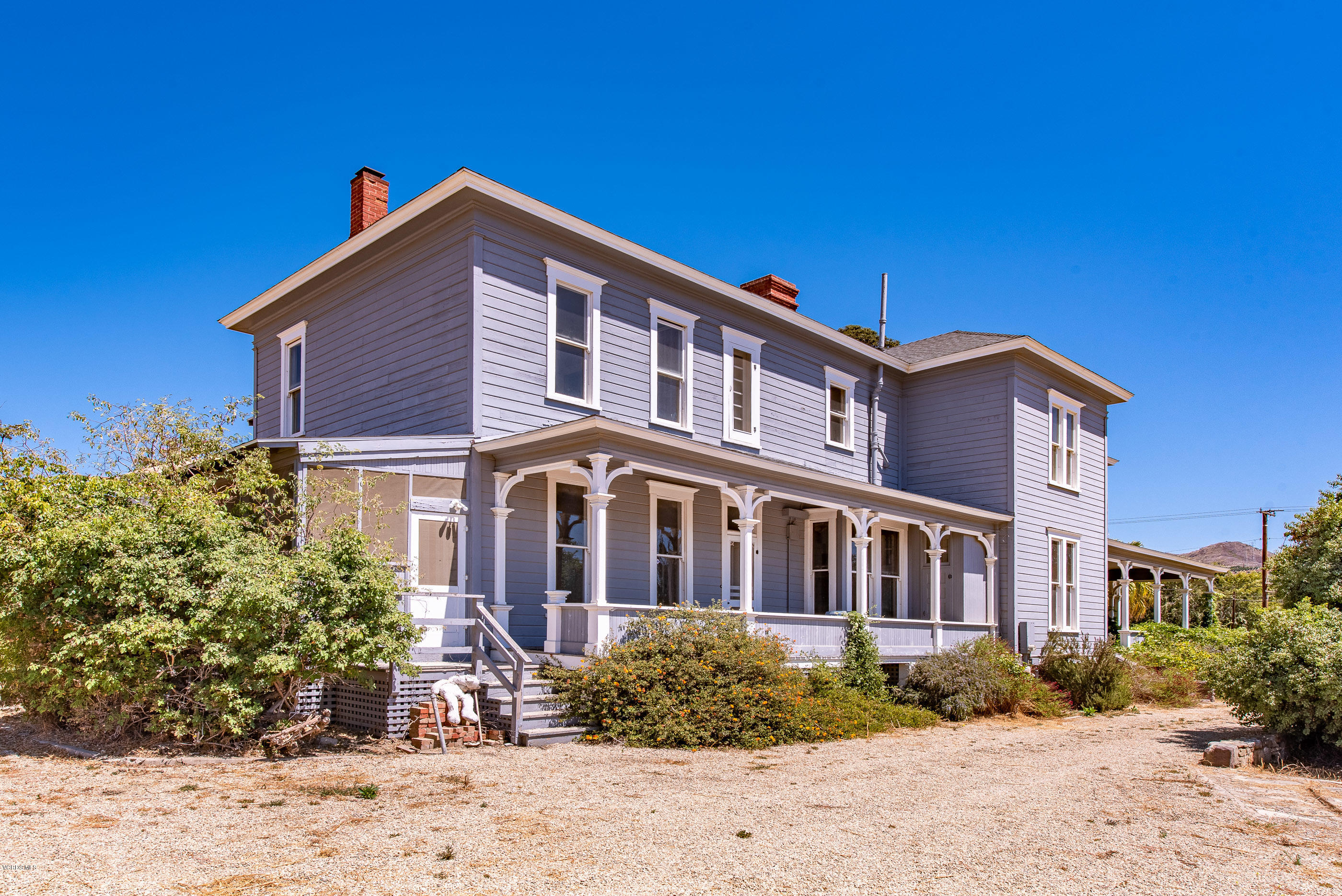 1226 Ojai Road Santa Paula, CA 93060 - Photo 4 of 73 a front view of a house with a yard