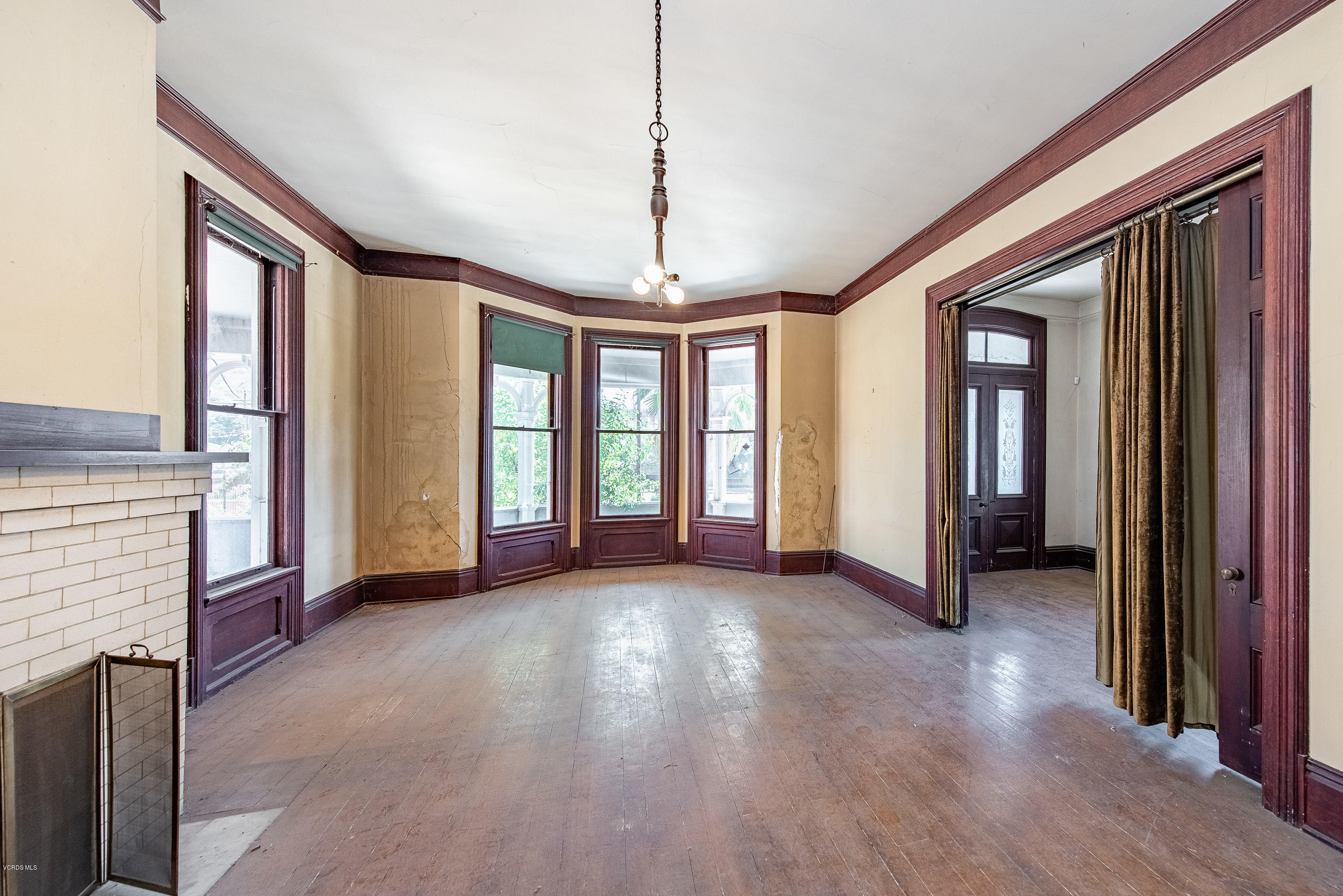 1226 Ojai Road Santa Paula, CA 93060 - Photo 5 of 73 a view of a room with large windows and a chandelier