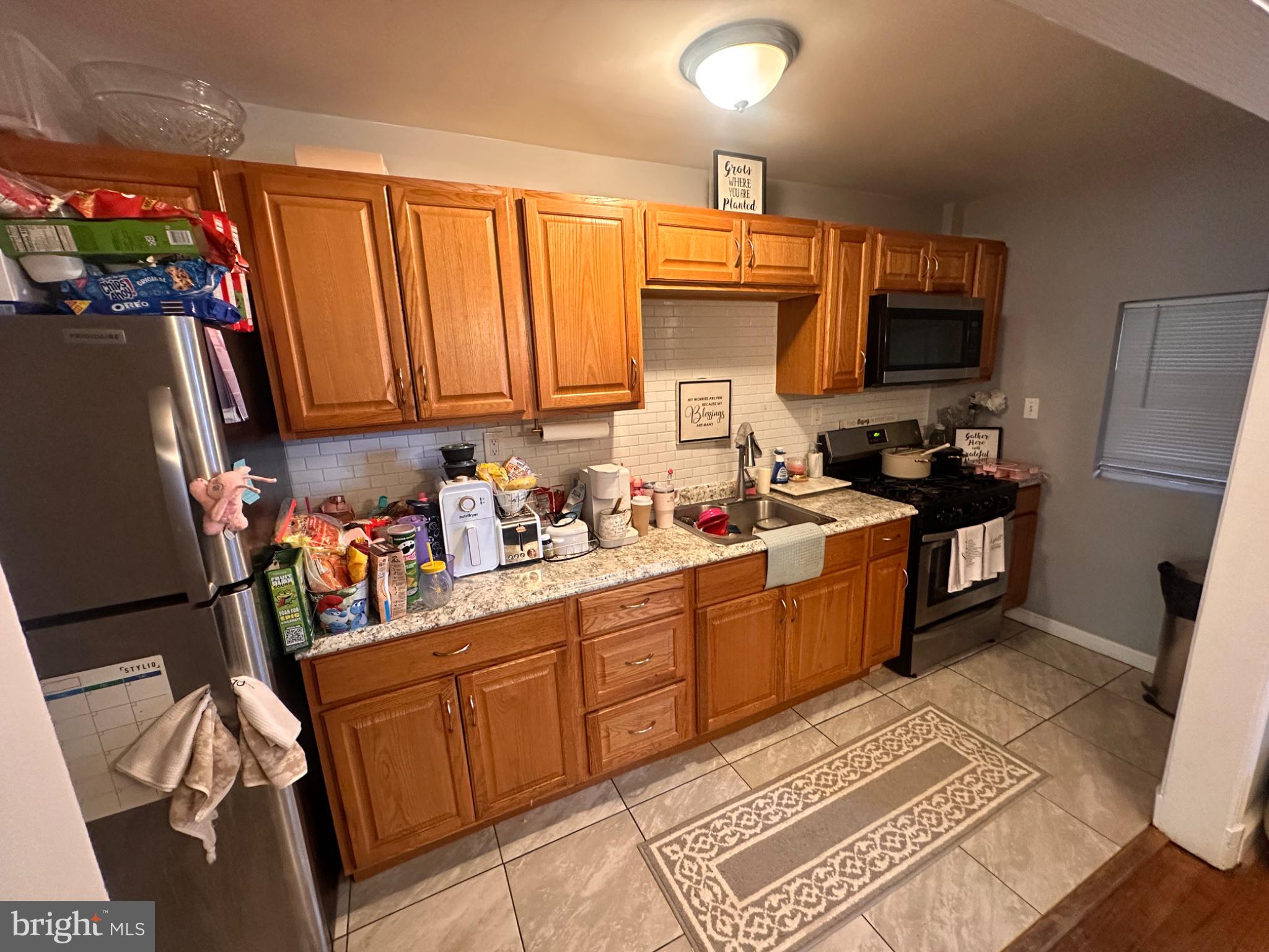 2725 North Rosedale Street Baltimore, MD 21216 - Photo 9 of 21 Cozy kitchen with warm wooden tones.