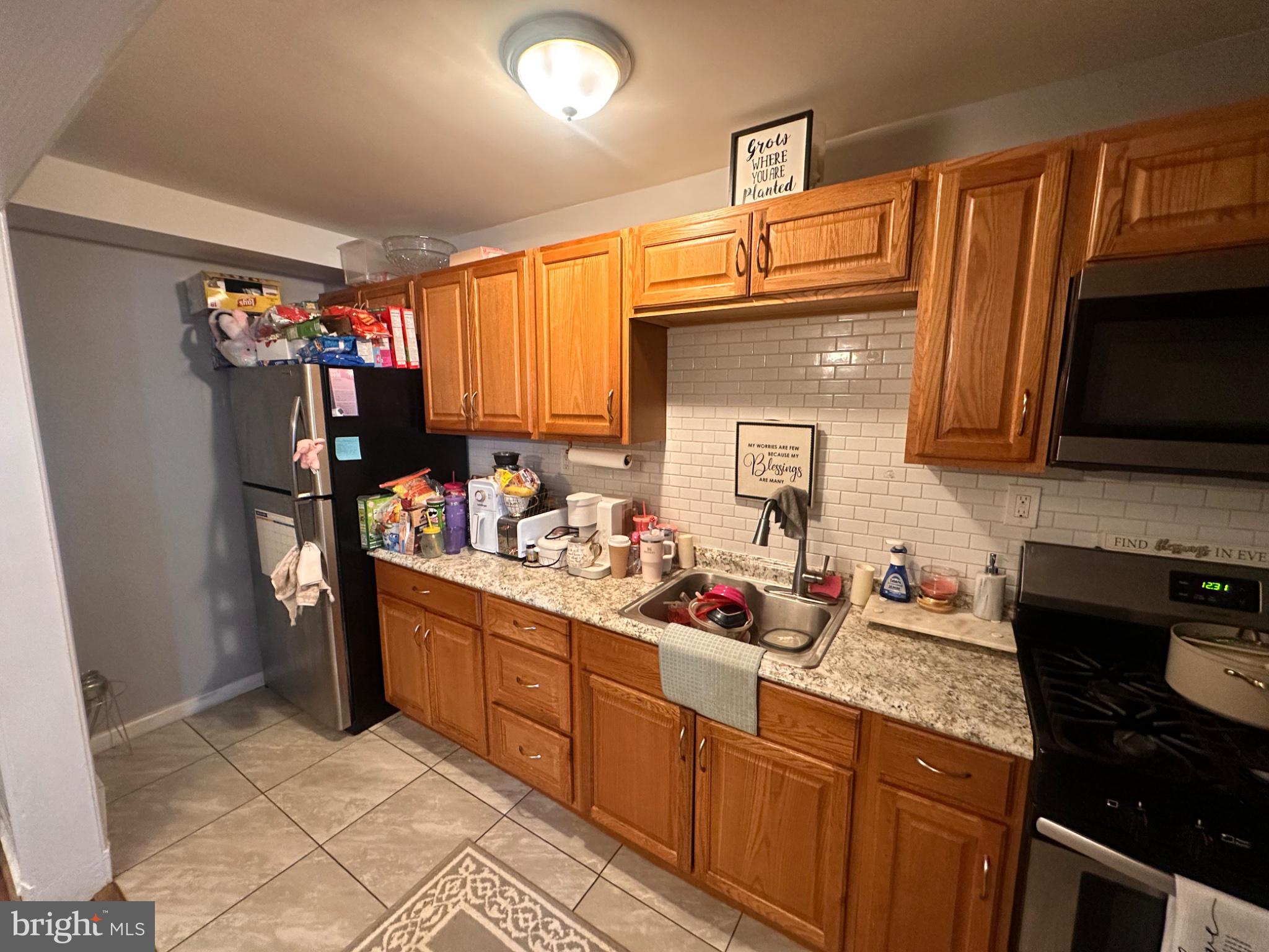 2725 North Rosedale Street Baltimore, MD 21216 - Photo 10 of 21 Cozy kitchen with warm wooden tones.
