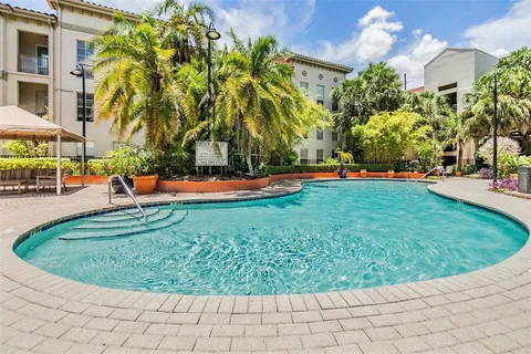 a view of a park with swings and slides