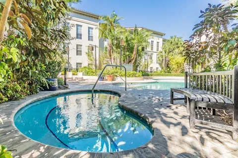 a view of a swimming pool with a patio