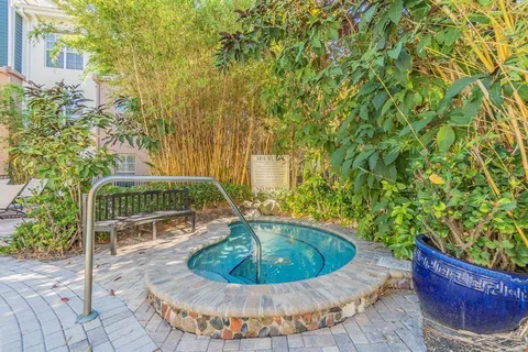 a view of a house with a tub and trees