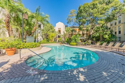 a view of a swimming pool with a patio