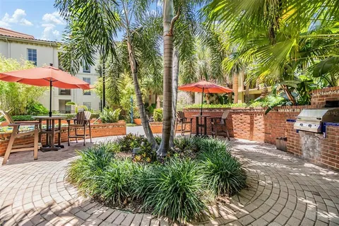 an outdoor space with patio and umbrella