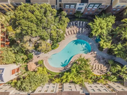 a view of a swimming pool with a garden