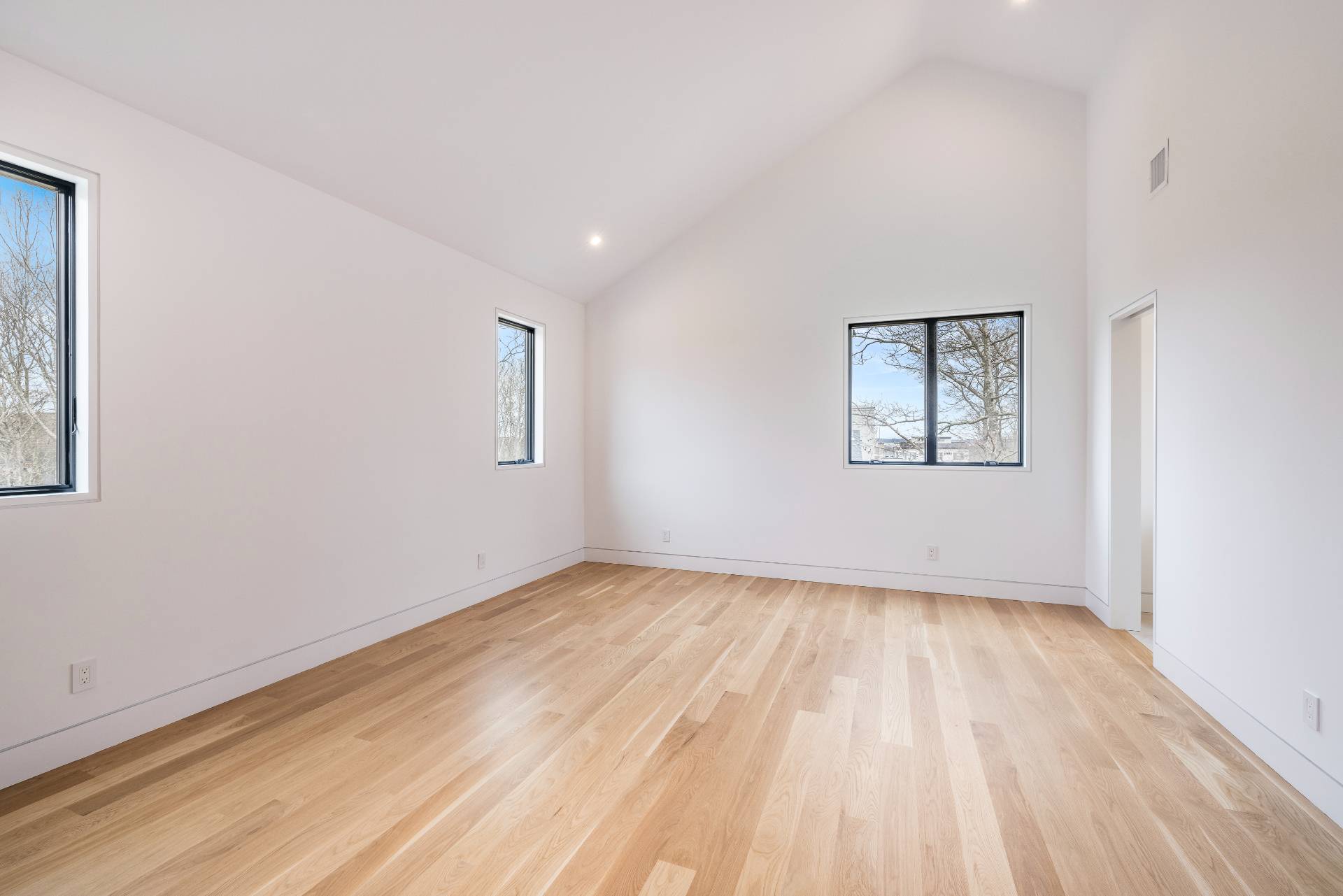 95 Highview Drive Sag Harbor, NY 11963 - Photo 14 of 22 a view of an empty room with wooden floor and a window