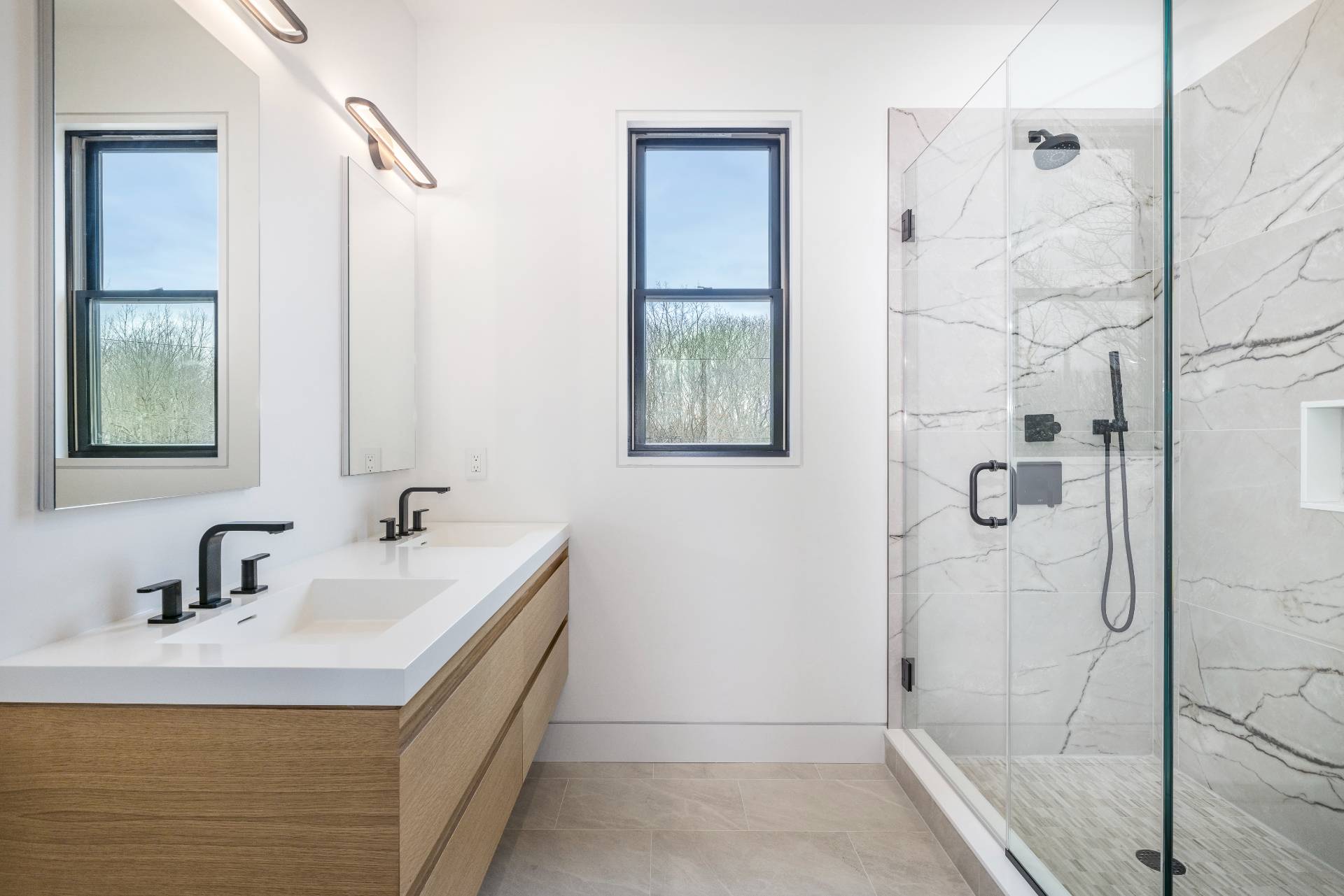 95 Highview Drive Sag Harbor, NY 11963 - Photo 15 of 22 a bathroom with a double vanity sink and shower