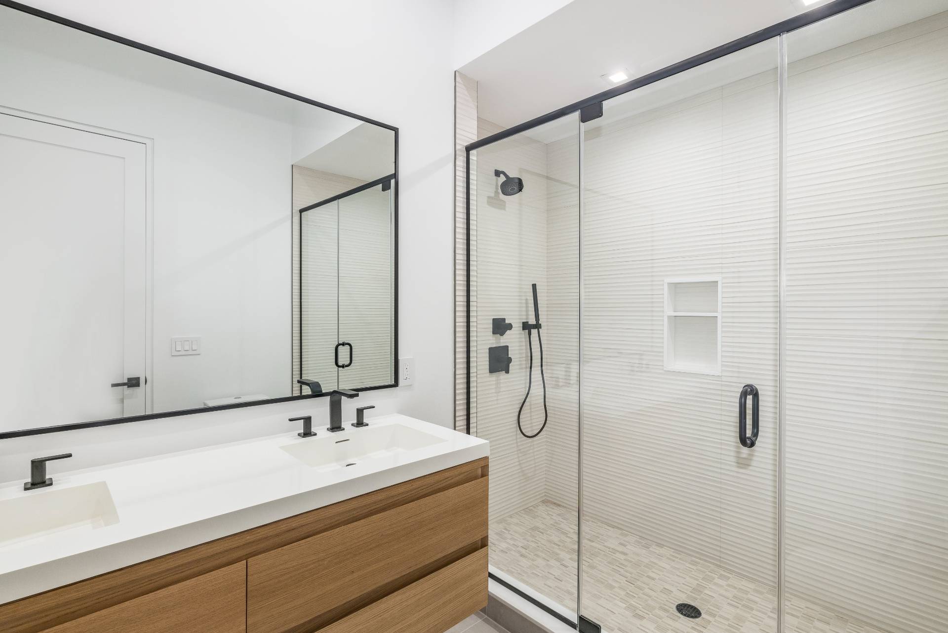95 Highview Drive Sag Harbor, NY 11963 - Photo 17 of 22 a bathroom with a shower sink and mirror