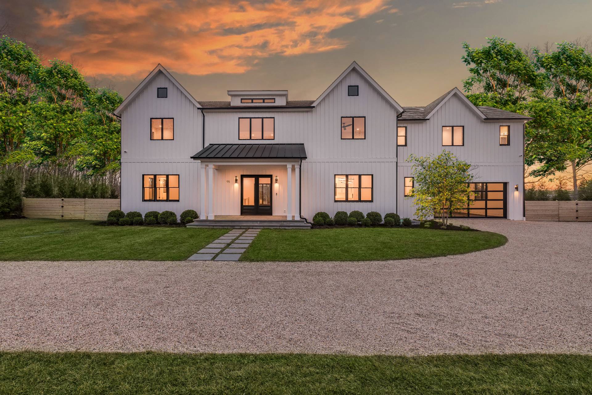 95 Highview Drive Sag Harbor, NY 11963 - Photo 21 of 22 a front view of a house with a yard and garage
