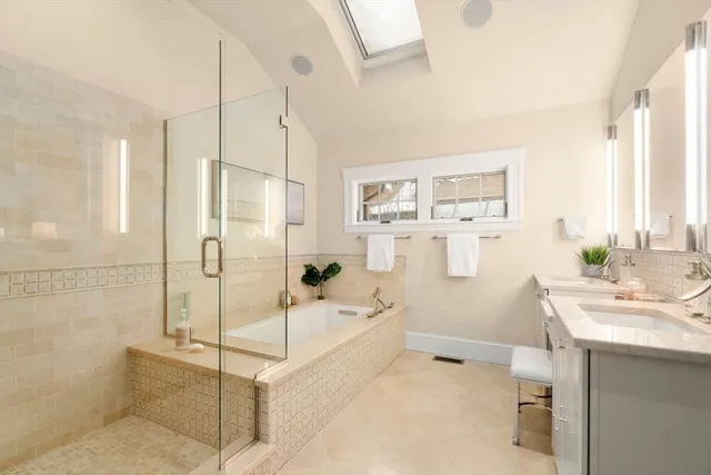 a bathroom with a bathtub and a shower