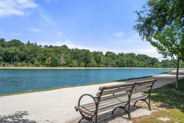 a close up of a fireplace with a sink and a mirror