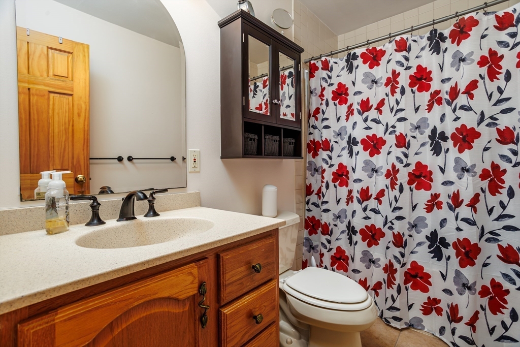 25 Ellis Road Westminster, MA 01473 - Photo 21 of 32 a bathroom with a sink toilet and vanity