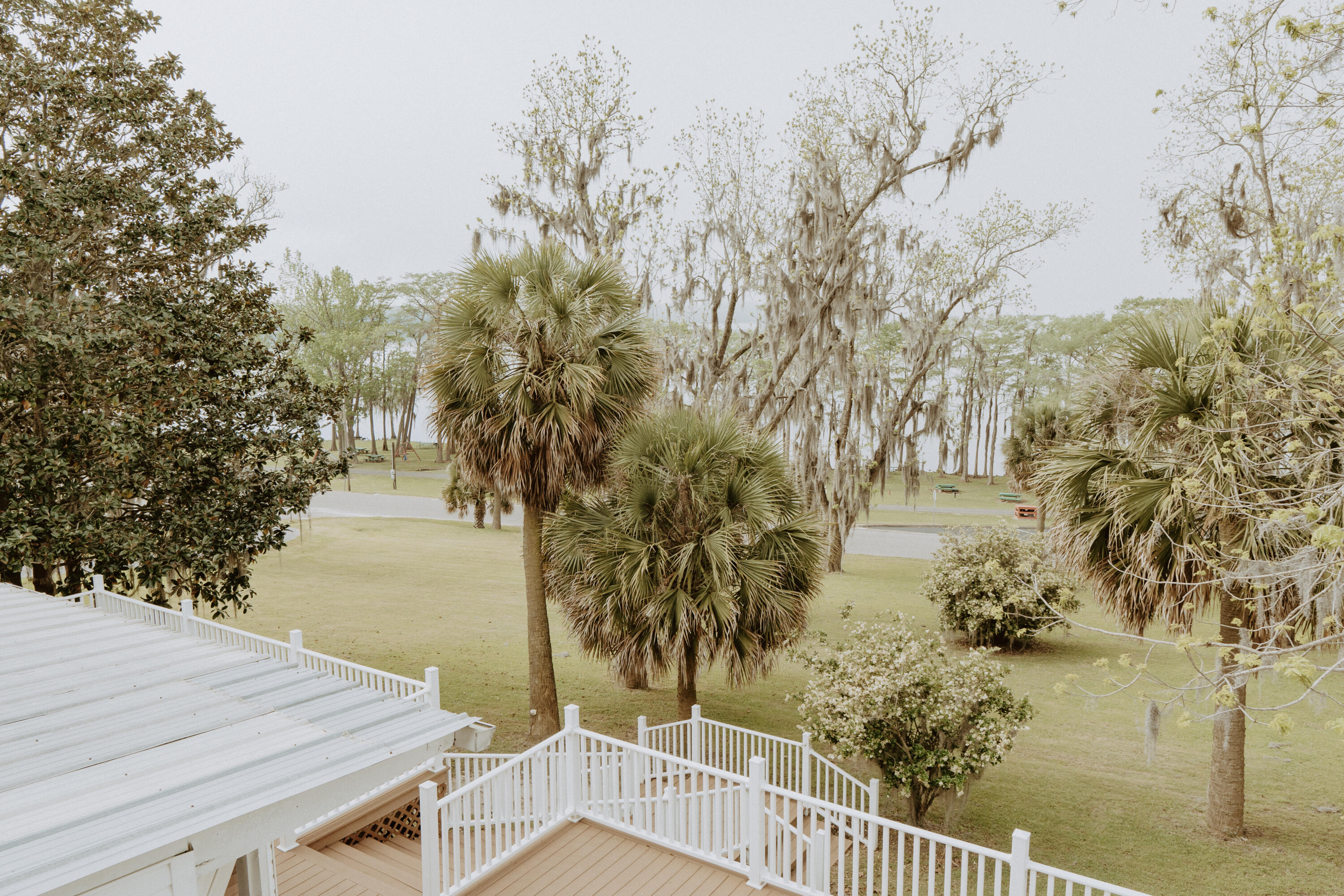 23622 Fifth Avenue Florala, AL 36442 - Photo 26 of 91 a view of a wooden floor and lake next to a yard