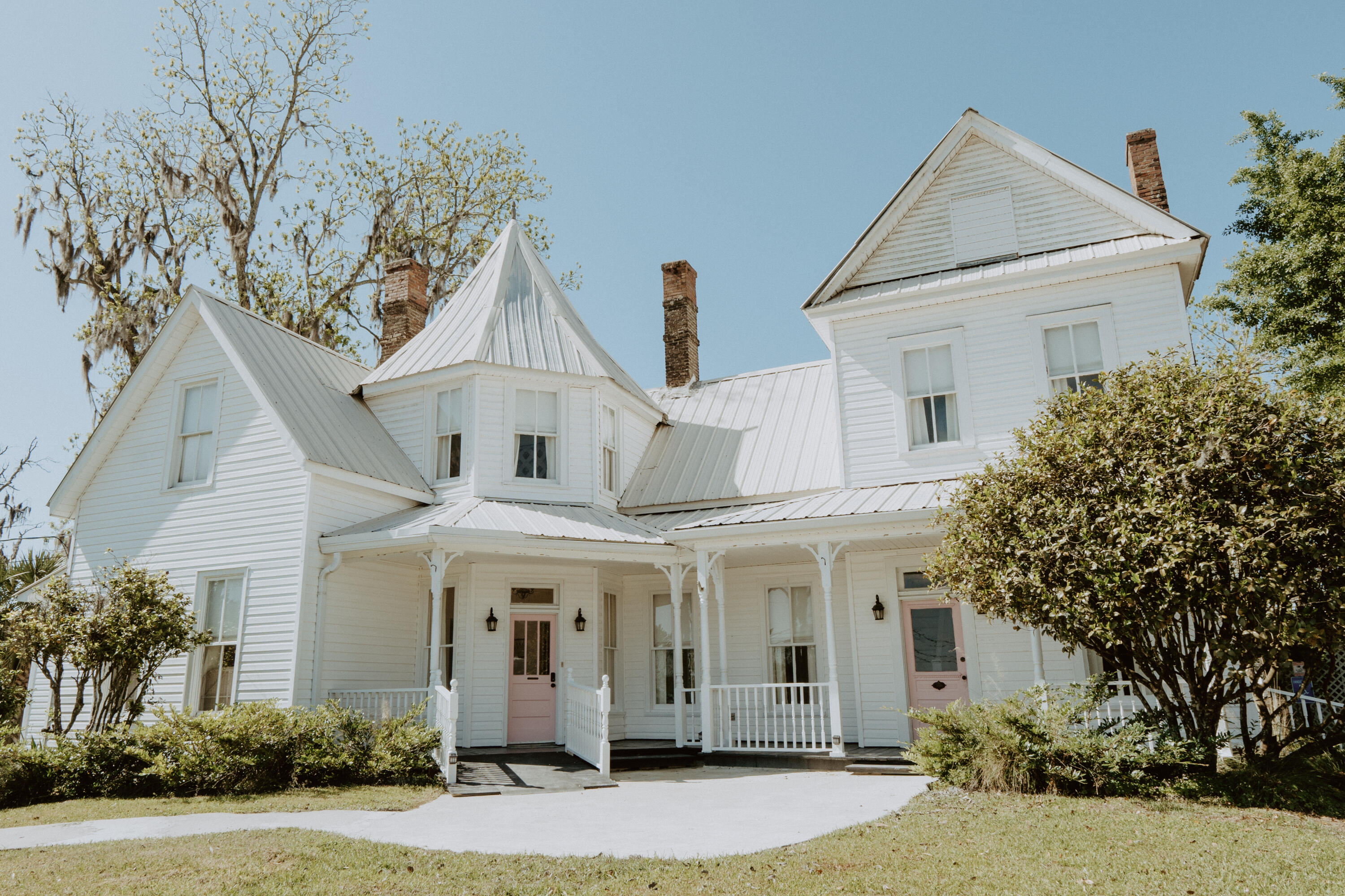 23622 Fifth Avenue Florala, AL 36442 - Photo 83 of 91 a view of white house with a yard and potted plants