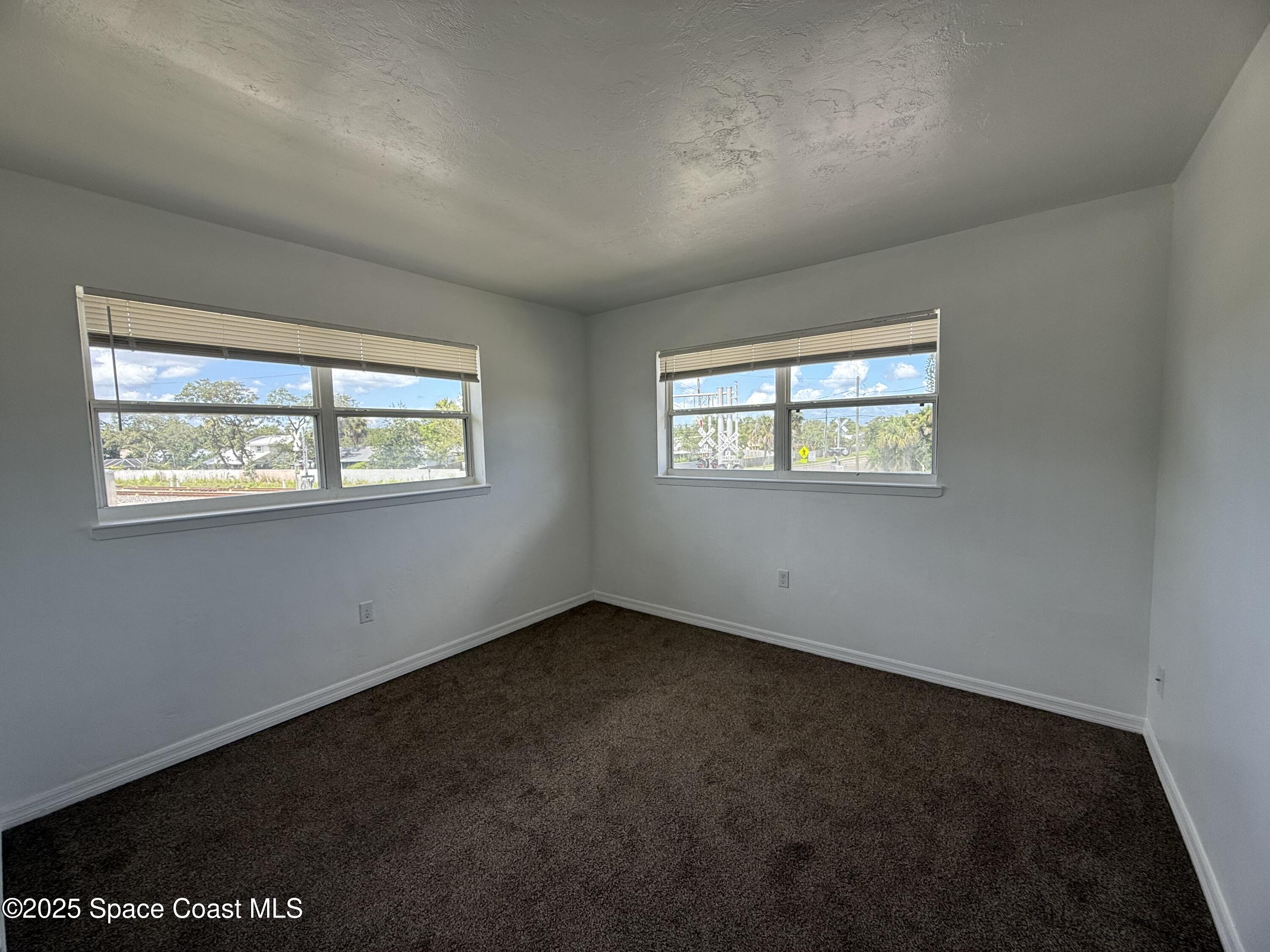 1440 Parkway Drive, Unit 7A Melbourne, FL 32935 - Photo 12 of 27 a view of an empty room with a window