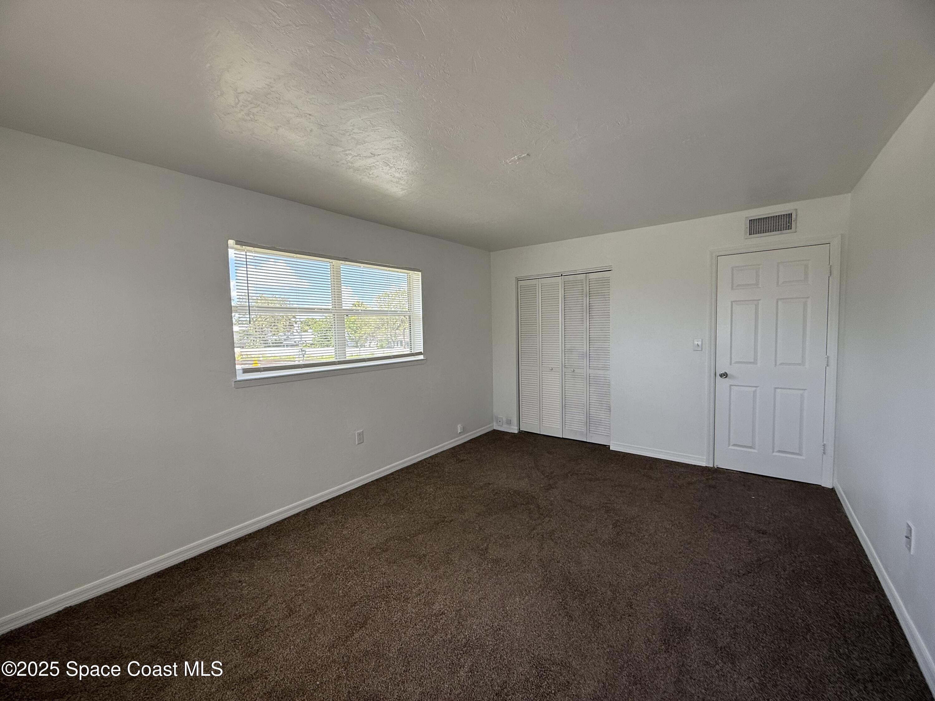 1440 Parkway Drive, Unit 7A Melbourne, FL 32935 - Photo 20 of 27 a view of an empty room with a window