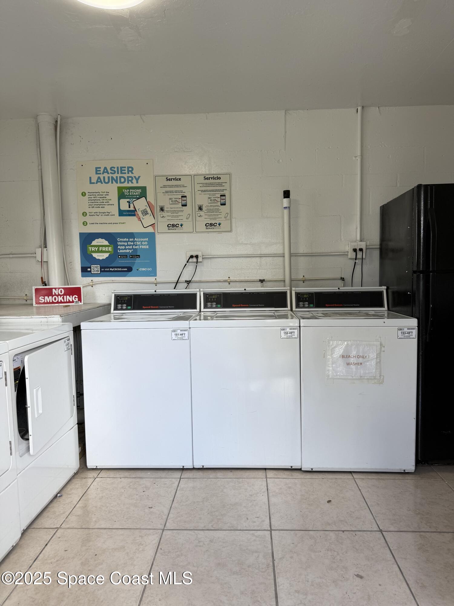 1440 Parkway Drive, Unit 7A Melbourne, FL 32935 - Photo 24 of 27 a kitchen with granite countertop a sink a stove and a refrigerator